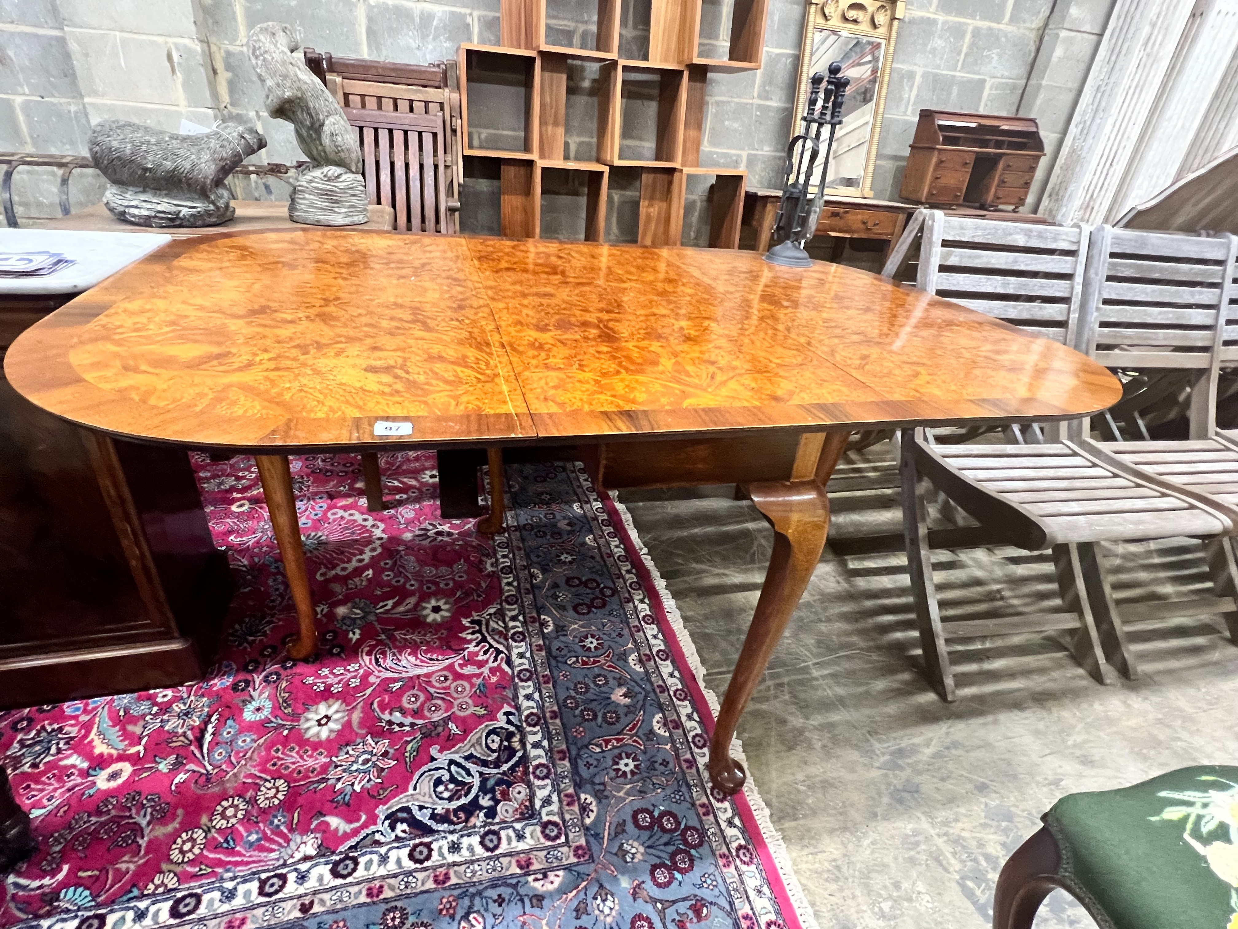 A Queen Anne Walnut revival burr walnut pad foot drop leaf dining table, extended 144cm width 99cm height 74cm